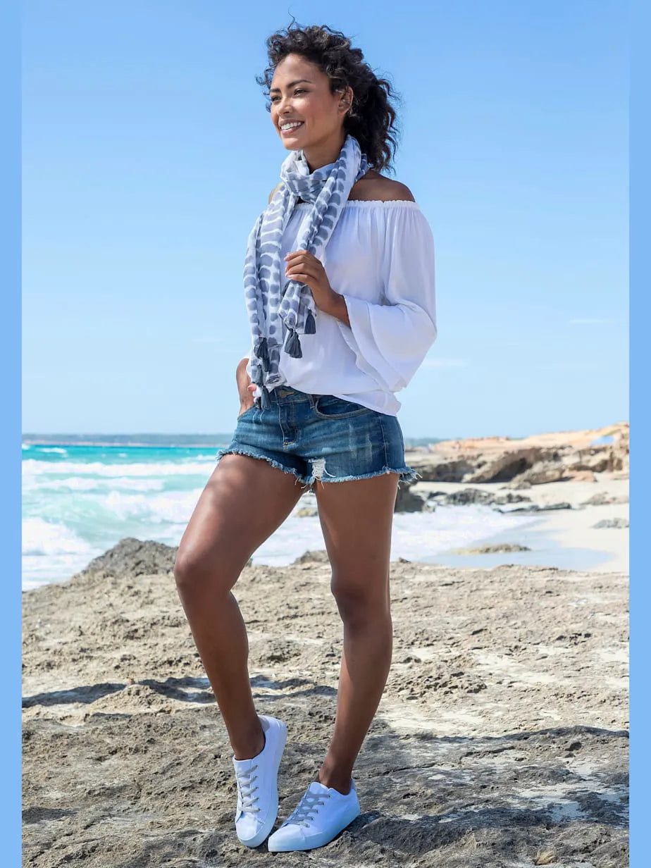 Mini-shorts in denim with franges and effet vintage