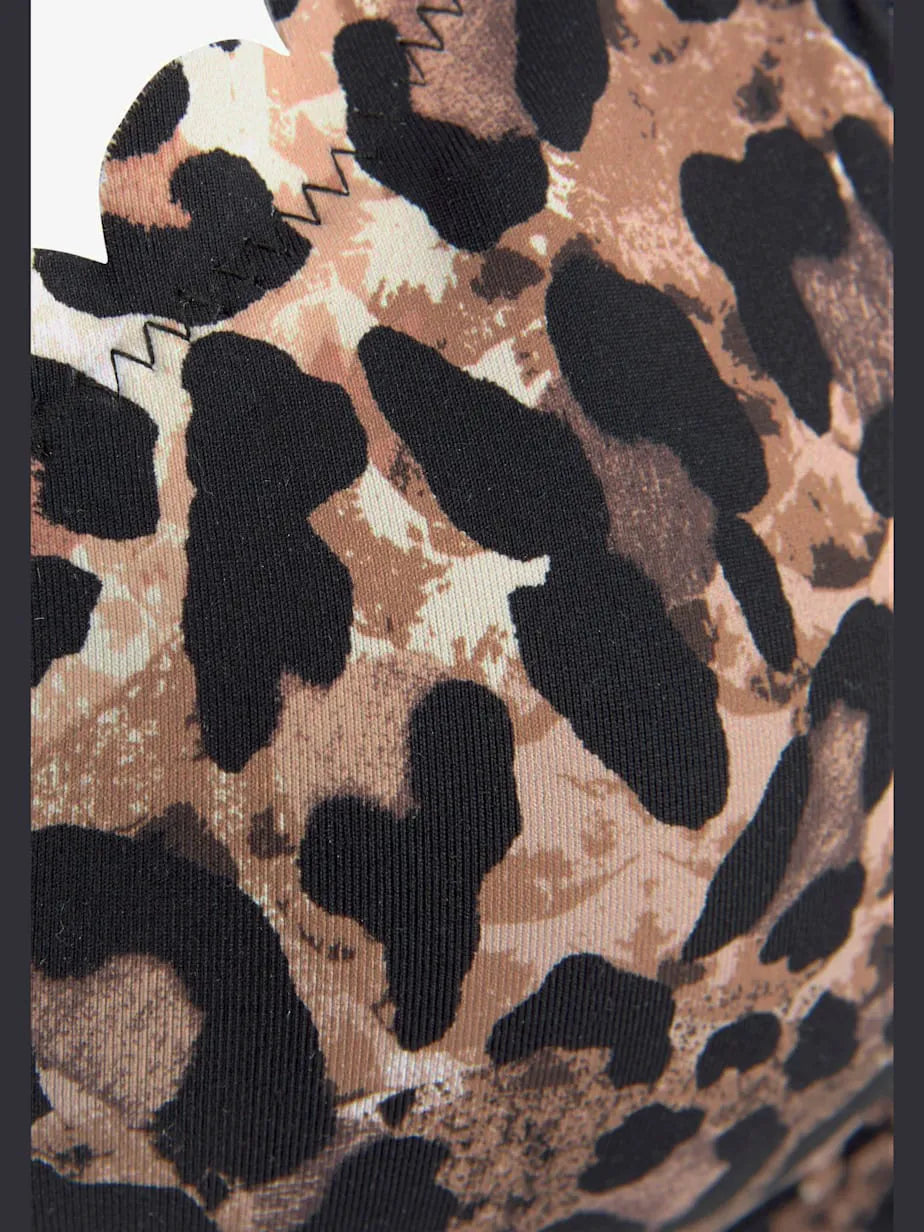 top of swimsuit with armatures with printed leopard and edges wavy