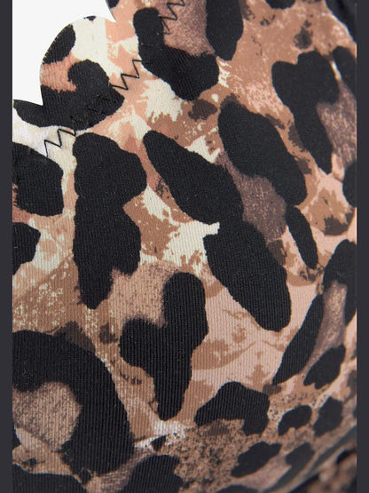 top of swimsuit with armatures with printed leopard and edges wavy